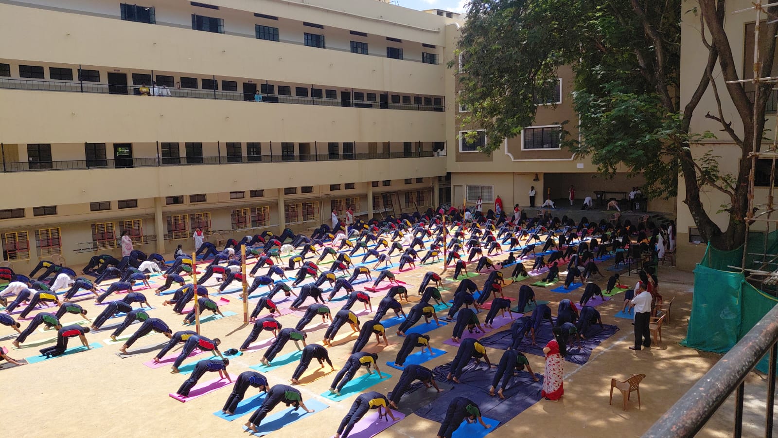 Students practising yoga in the VET School courtyard